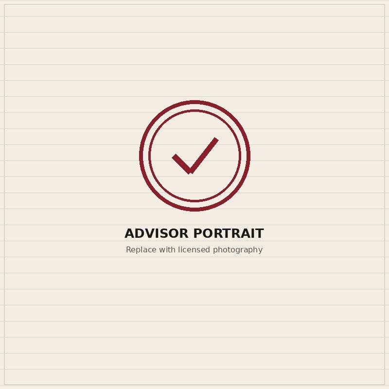 A smiling advisor in an office, ready to take a client call.